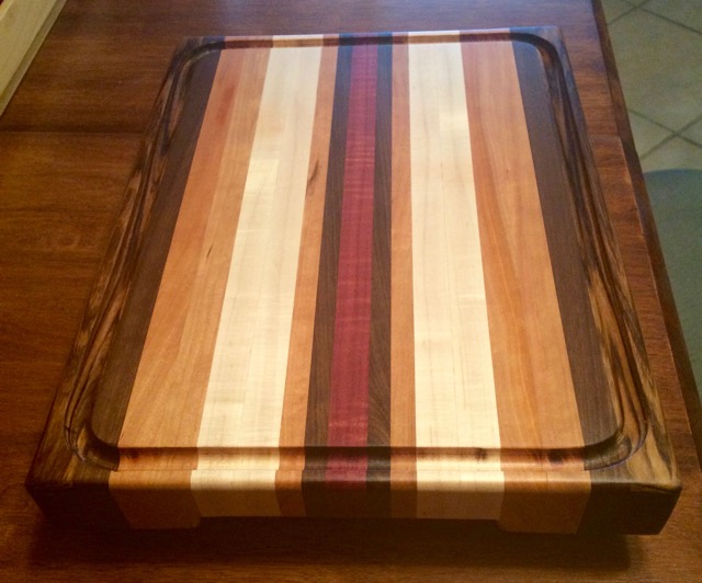 12.5x16.5x1.5 Inch Cutting Board. This one is an example. My wife claimed it.